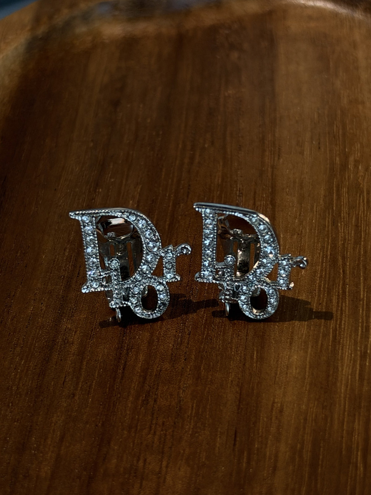 Crystal logo clip earrings, silver-tone