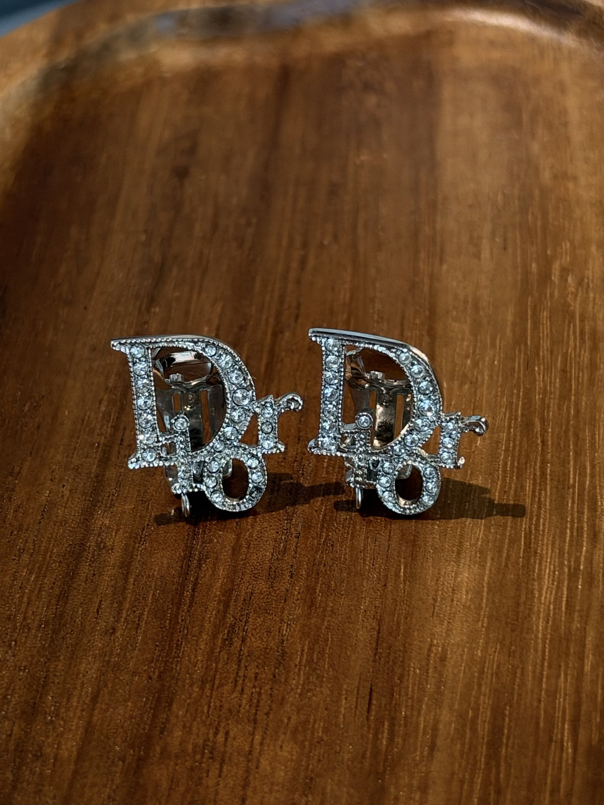 Crystal logo clip earrings, silver-tone