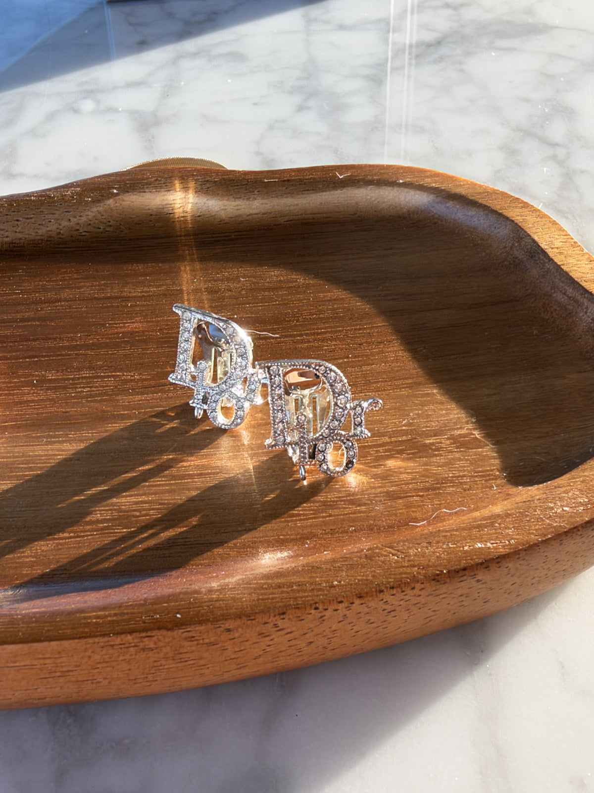 Crystal logo clip earrings, silver-tone