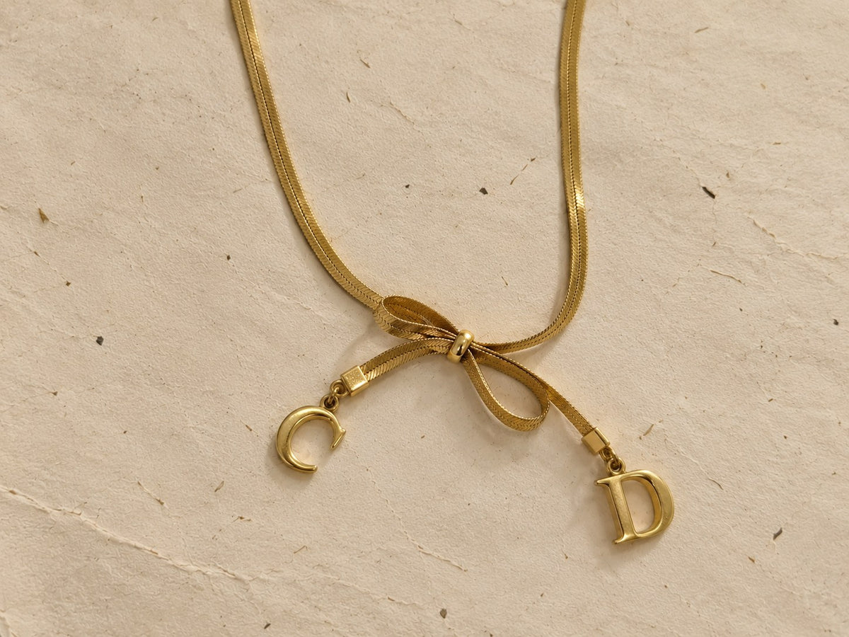 Bow necklace with C and D charms
