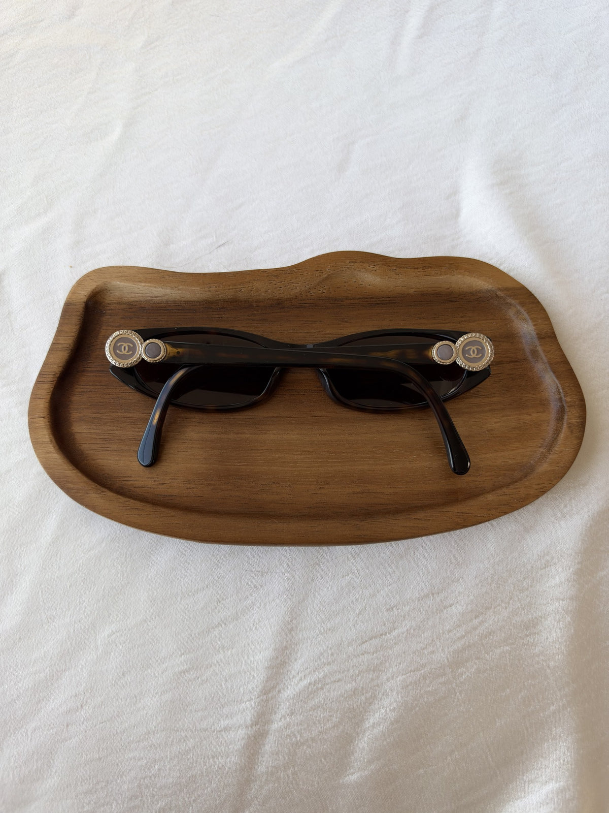 Tortoiseshell sunglasses with CC medallions