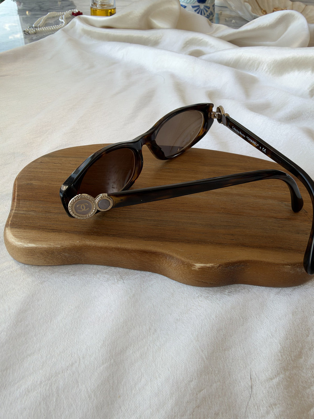 Tortoiseshell sunglasses with CC medallions