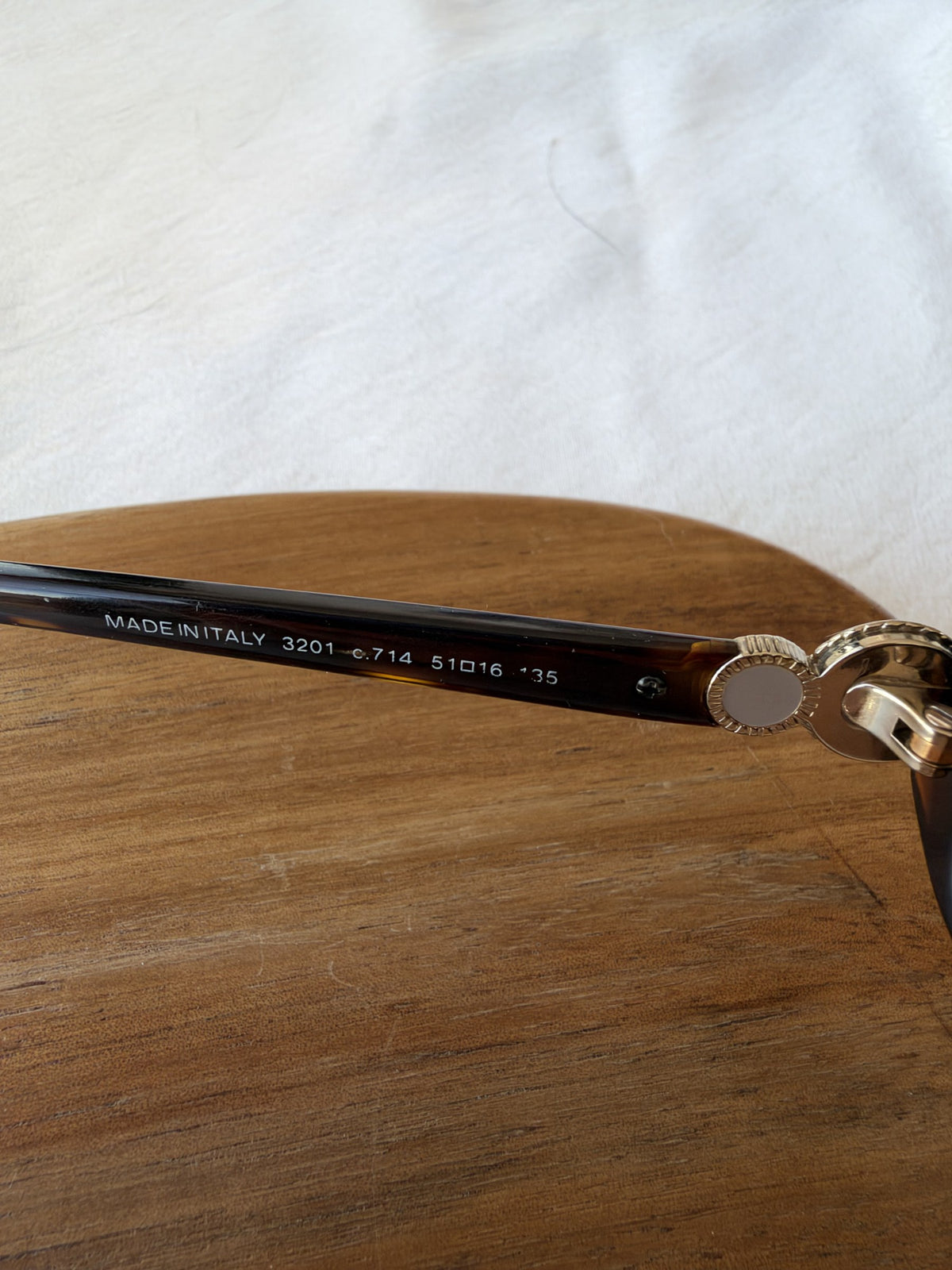 Tortoiseshell sunglasses with CC medallions