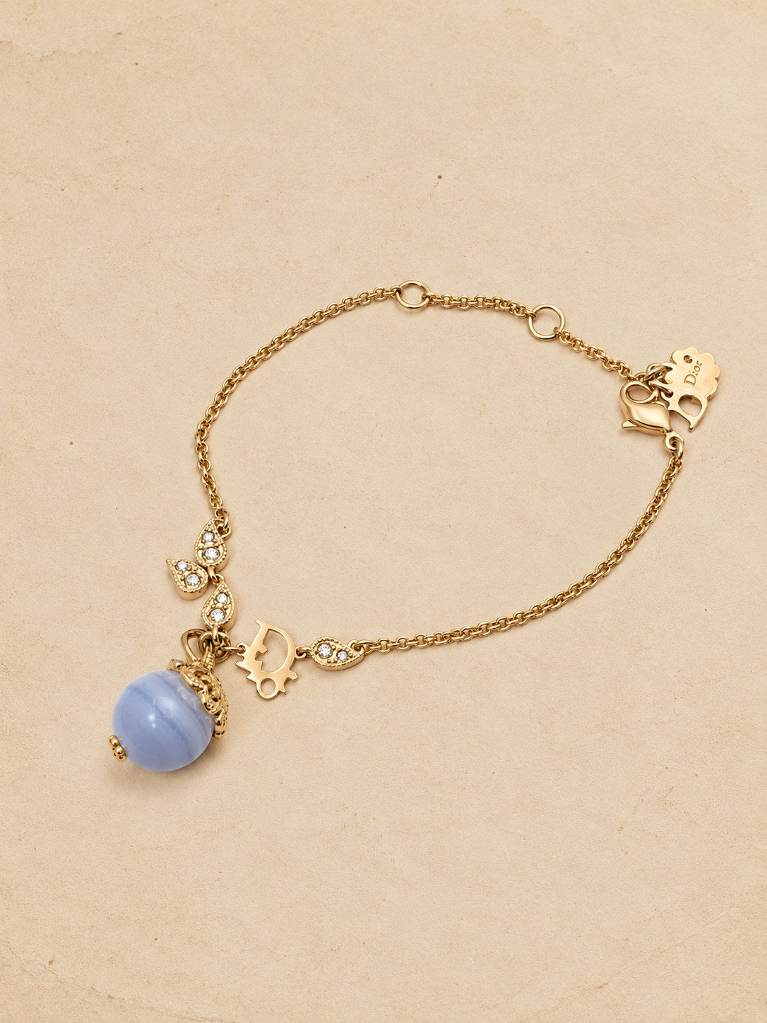 Charm bracelet with blue bead