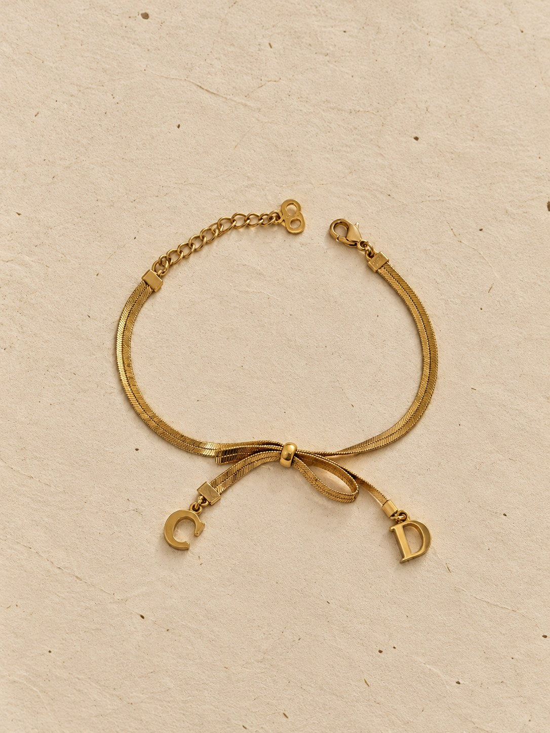 Bow bracelet with C and D charms