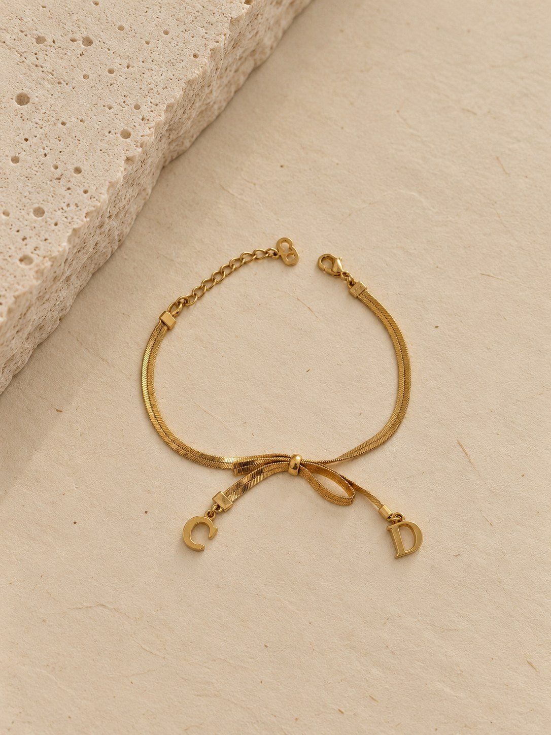 Bow bracelet with C and D charms